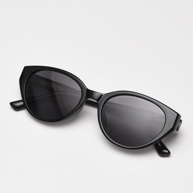 Vintage cat eye polarized sunglasses for women, glossy black TR90 frame UV400 tinted lenses studio white background main product photo