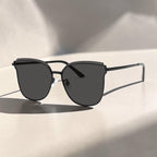 AvilaDubee DB7242 variant oversized cat eye sunglasses, matte black lightweight stainless steel frame solid classic grey UV400 anti-glare nylon lenses white background studio product image for men women daily driving