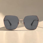 Front view studio shot of AvilaDubee DB7258 luxury square sunglasses, thin rose gold stainless steel frame solid classic grey UV400 anti-glare lenses women everyday travel eyewear