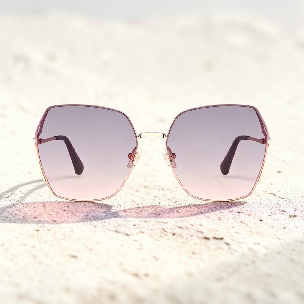 Beach sand texture background photo of AvilaDubee DB7258 rose gold square sunglasses, lavender gradient tint UV400 lenses ideal for summer vacation and beach travel outfits