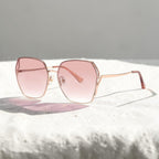 AvilaDubee DB7258 thin rose gold stainless steel square sunglasses, blush pink gradient UV400 glare reduction lenses shot on soft fabric surface for casual street style