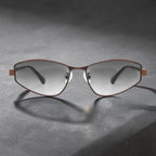 Concrete texture studio photo of AvilaDubee slim angular metal sunglasses, coffee brown frame gradient grey UV protective lenses lightweight unisex fashion eyewear for travel & daily wear