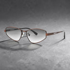 Dark texture background shot of AvilaDubee unisex Y2K slim metal sunglasses, coffee brown frame gradient grey UV lenses futuristic angular silhouette streetwear outfit accessory