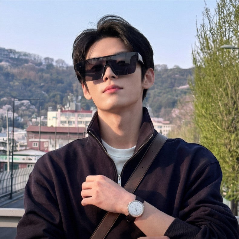 Young asian male model wearing AvileDubee HB80385 black shield sunglasses, outdoor city mountain background casual jacket streetwear fashion photography