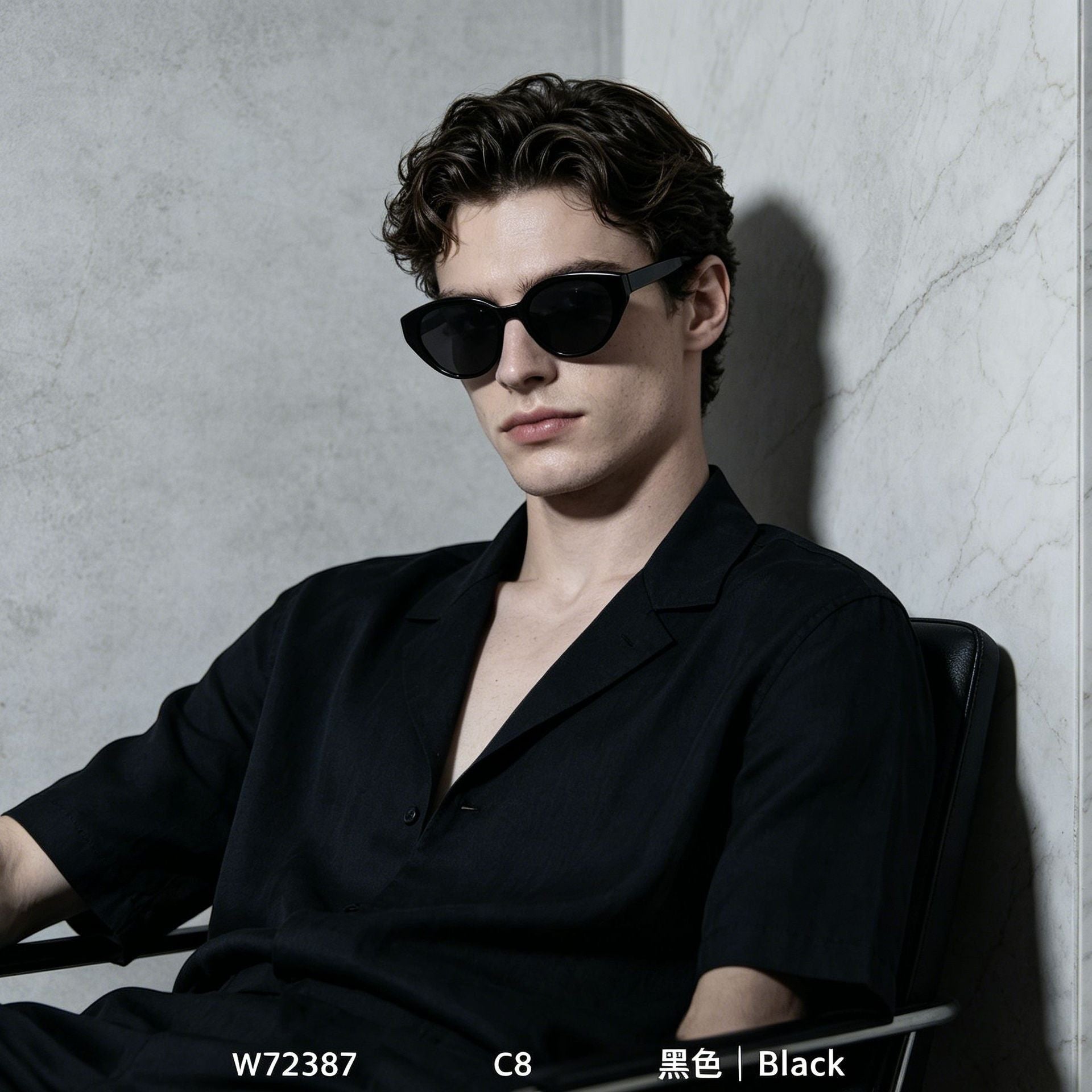 Male model wearing glossy black retro cat eye polarized sunglasses, minimalist marble wall background street style eyewear
