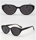 Vintage cat eye sunglasses variant, glossy black full frame with dark grey UV400 polarized lenses white background studio photo