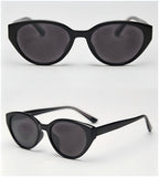 Vintage cat eye sunglasses variant, glossy black full frame with dark grey UV400 polarized lenses white background studio photo