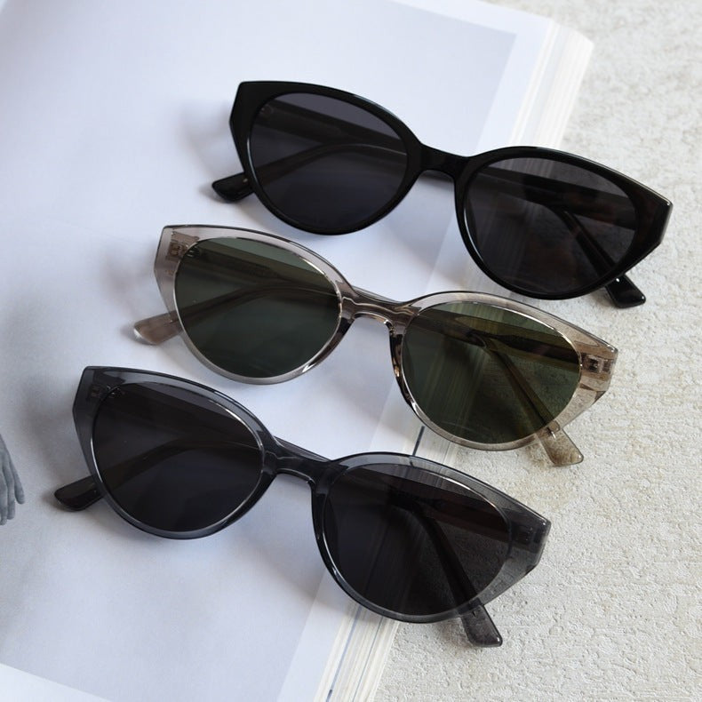 Flat lay banner of 3 color options retro cat eye polarized sunglasses, black, khaki & clear grey frames women fashion eyewear collection