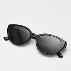 Vintage cat eye polarized sunglasses for women, glossy black TR90 frame UV400 tinted lenses studio white background main product photo