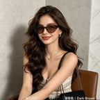 Female model wearing retro cat eye dark brown frame sunglasses, elegant casual outfit marble background women fashion eyewear